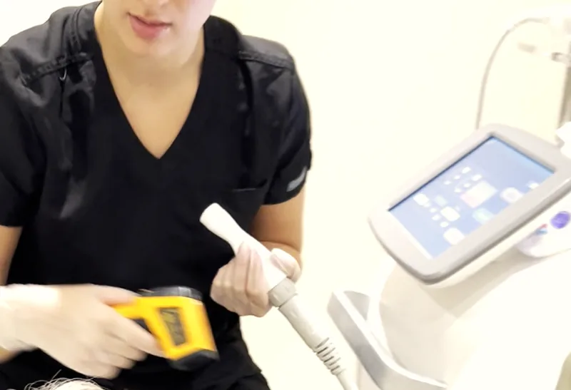 A clinician delivering a skin treatment at The Hampton Clinic in Bristol